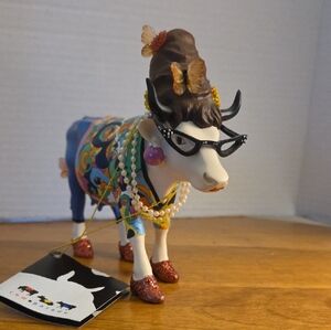 Whimsical Cow Figurine with Colorful Accents